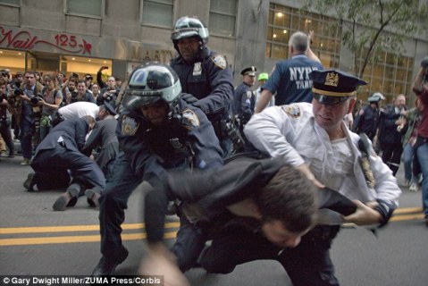 Occupy Wall Street protesters are arrested during a march in Manhattan, October 2011.