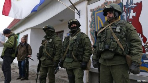 Russian soldiers have taken up positions outside Ukrainian military barracks across Crimea.