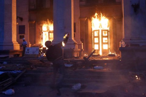 A pro-Kiev protester throws a Molotov cocktail at the trade union building in Odessa, Ukraine May 2, 2014. Yevgeny Volokin—Reuters