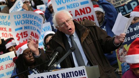 Sanders speaks to low-wage federal contract workers on Dec. 4, 2014, during a protest where the workers demanded presidential action to win an increase to $15-an-hour wage.  - Win McNamee / Getty Images
